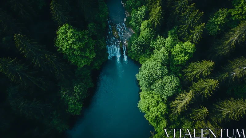 Aerial forest river corridor with cascading waterfall focus.