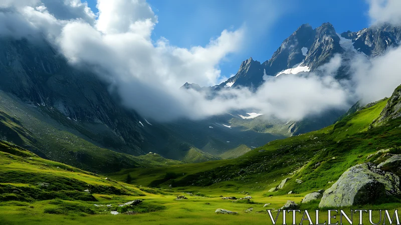 Green alpine valley under dramatic clouds and peaks.