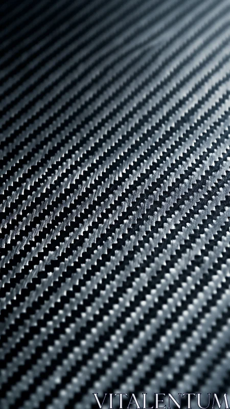 Carbon fiber weave macro with diagonal high-contrast pattern.