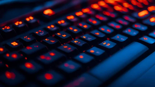 Low-angle macro of RGB mechanical keyboard backlighting.