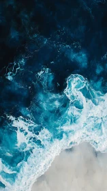 Rolling teal waves meeting soft sand in calm embrace.