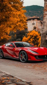 Scarlet sports car gliding through golden autumn charm.