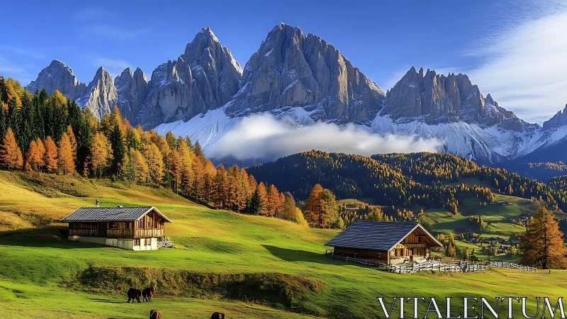 Autumnal alpine valley showcases chalets beneath jagged peaks