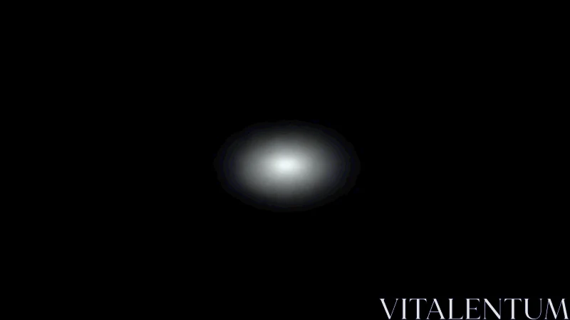 Isolated white glow centered in stark black field.