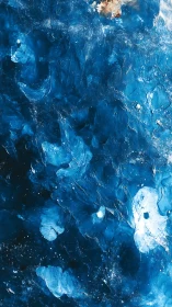 Close-up view of textured blue ice with scattered inclusions.