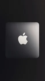 Minimalist metallic device top with centered logo mark design.