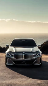 Front view sedan showcases LED DRLs and coastal backlit reflections