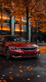 Crimson BMW sedan poised on wet street under autumn trees.