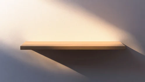 Cantilevered wooden shelf under oblique directional lighting.