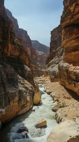High-walled sandstone canyon with fast whitewater river channel