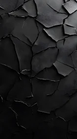 Fragmented dark surface with layered cracked panels.