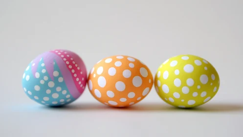 Polka-dotted pastel eggs quietly rehearse for spring