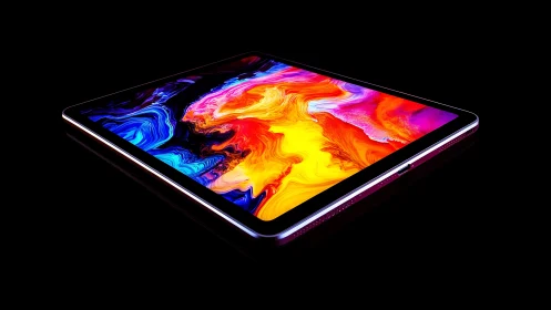 Luminous tablet screen bursts with bold swirling color