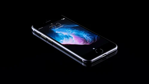 Sleek smartphone glows against deep black reflective surface.