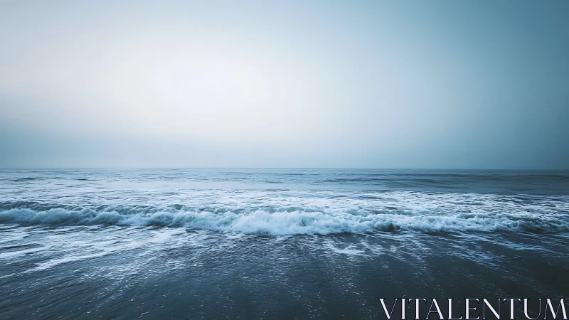 Gentle blue waves roll softly toward a calm open horizon