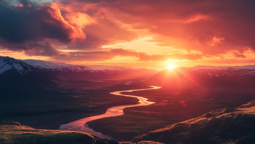 Warm river valley sunset glowing beneath gentle clouds.