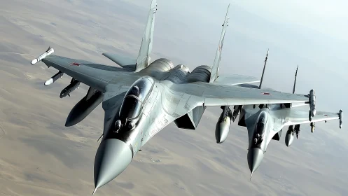 Twin desert raptors carve silver shockwaves through silence