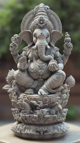 Intricately carved Ganesha idol with high-relief ornamental detailing