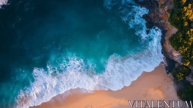 Aerial coastal surf impact on sandy beach and rocky headland