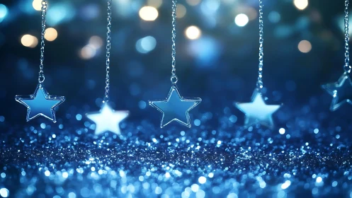 Silver star ornaments over blue bokeh glitter background.