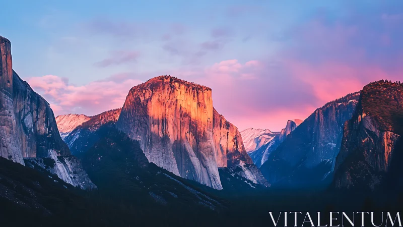 Sunlit granite cliffs glow beneath vibrant pink sunset clouds.