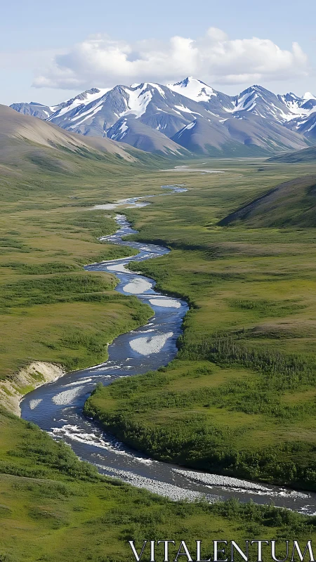 River ribbon curls toward stoic, snowlit mountain guardians