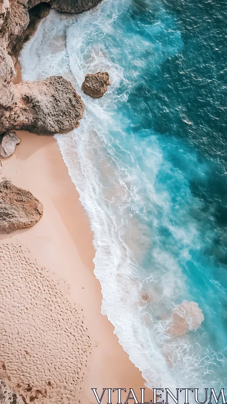 Vertical aerial view of rocky shoreline and sand beach.
