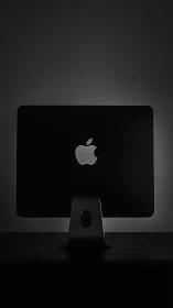 Minimalist desktop monitor silhouette with rim lighting.