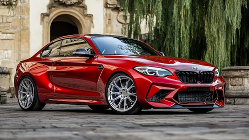 Crimson coupe prowls cobbled courtyard with polished precision