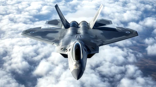 Stealth tactical fighter jet cruising above stratocumulus cloud deck