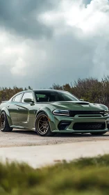 Green widebody muscle sedan sits on roadside under storm clouds
