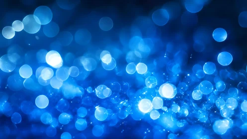 Abstract blue bokeh lights background with dreamy, soft focus.