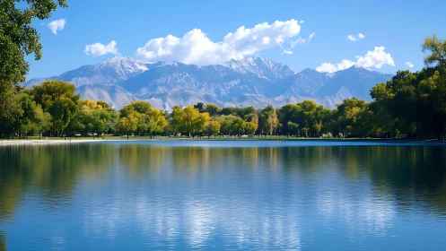 Mirror-lake morning cradled by luminous snowcapped peaks.