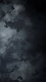 Dark textured concrete wall presents moody abstract surface