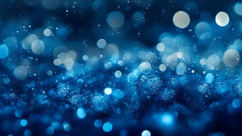 Blue bokeh particle field with shallow depth-of-focus rendering.