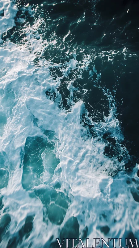 Overhead view of turbulent teal sea surface patterning.