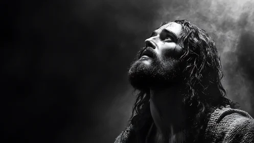 Dramatic low key portrait of bearded man in rising smoke