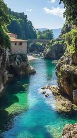 Narrow coastal inlet with stone bridge, cliffs and layered turquoise water