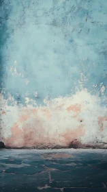 Weathered blue wall meets stone floor in quiet urban corner