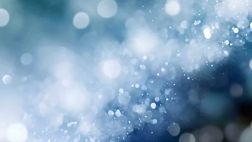 Iridescent blue bokeh field with soft luminous particles.