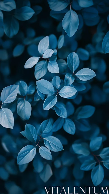 Gentle blue leaves drifting in a calm twilight hush.