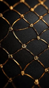Ornate golden lattice glows over textured black surface.