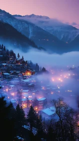 Mountain settlement with winter fog and evening lights.