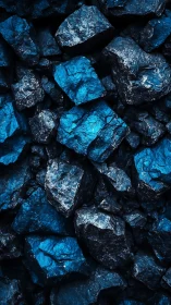 Stacked dark blue rocks form dense angular surface