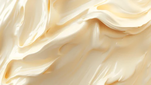 Smooth creamy texture in abstract close-up, soft pastel tones.