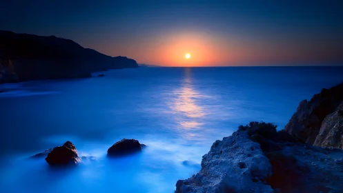 Long-exposure coastal sunset with smoothed surf and high contrast