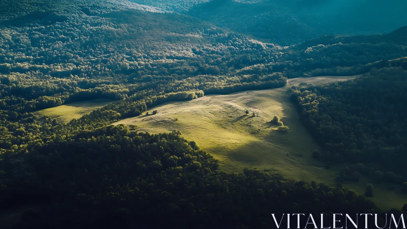 Gentle sunlight rolls across a quiet green mountain valley