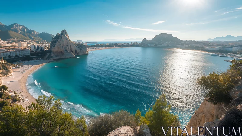 Sunlit Mediterranean bay curving beneath rocky headlands.