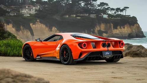 Orange Ford GT supercar is parked on a sandy beach