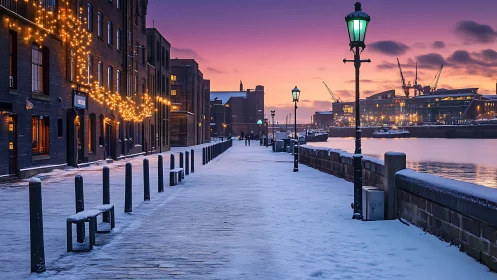 Snow-covered dockside promenade at urban waterfront at dusk.